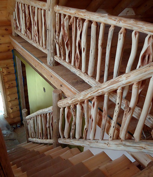 custom log railing for a staircase and upper balcony | Wood Stair Railings