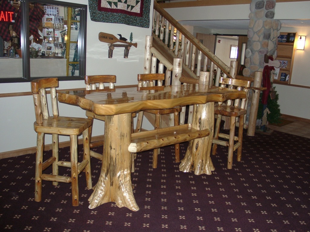 AmericanInn high-top table and chairs made from natural wood
