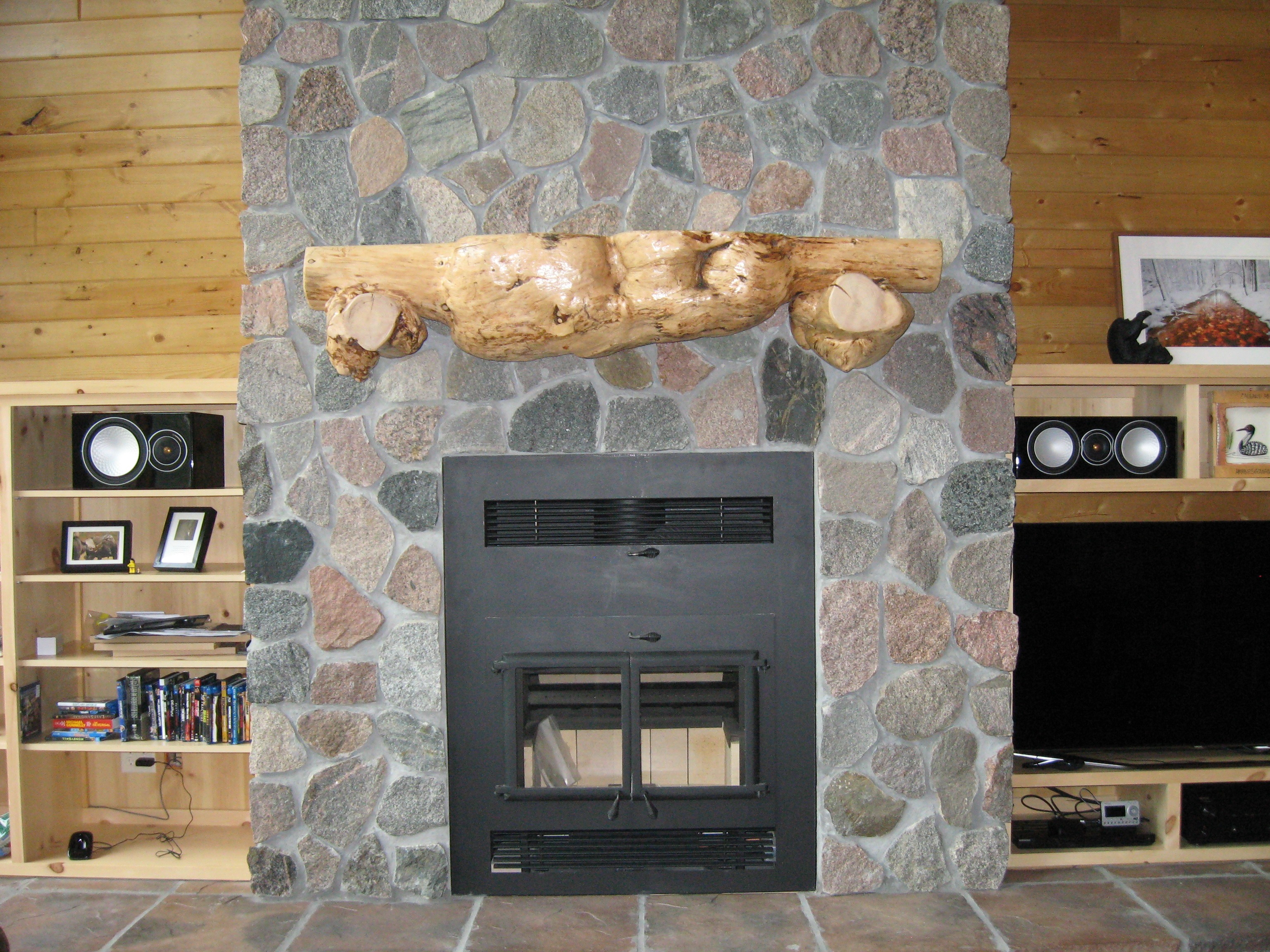 Natural tree shelf over the fireplace