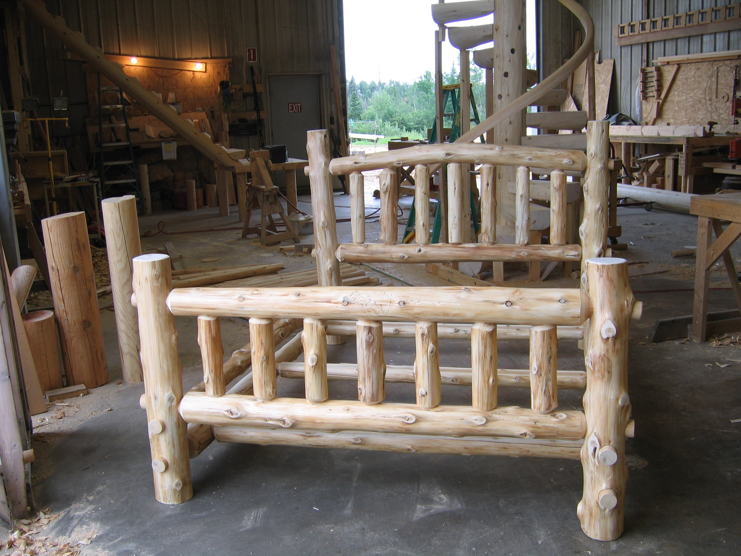 custom Rustic bed frame being made from timber logs