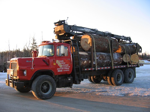 Log materials | Ryan's Rustic Railings log hauling truck