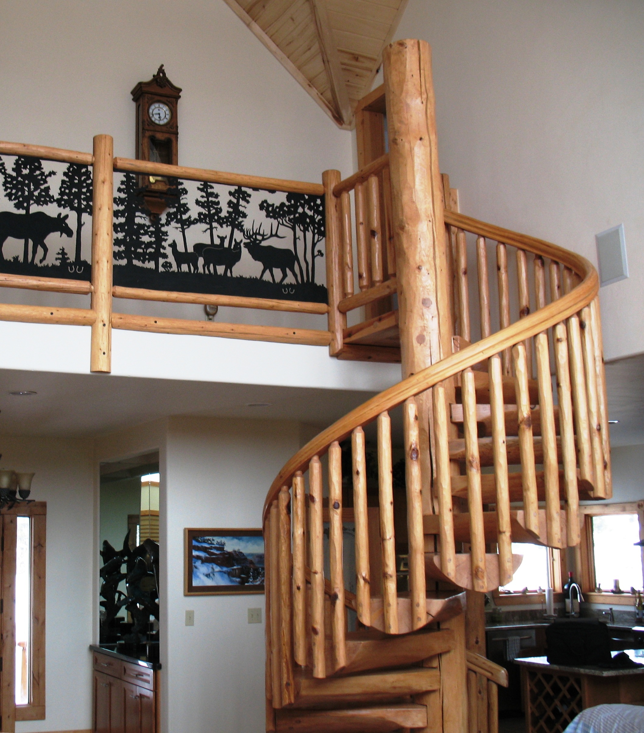 brand new log spiral staircase with metal deer railing details | Spiral Staircase