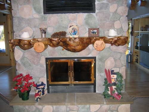 Custom fireplace mantel made from a tree by Ryan's Rustic Railings
