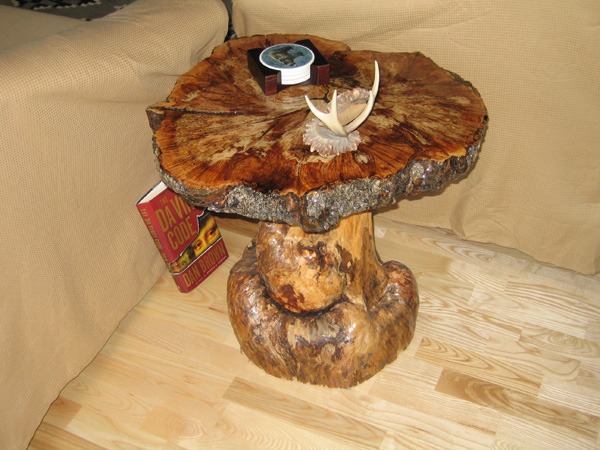 Wooden side table made from tree trunk and timber knot