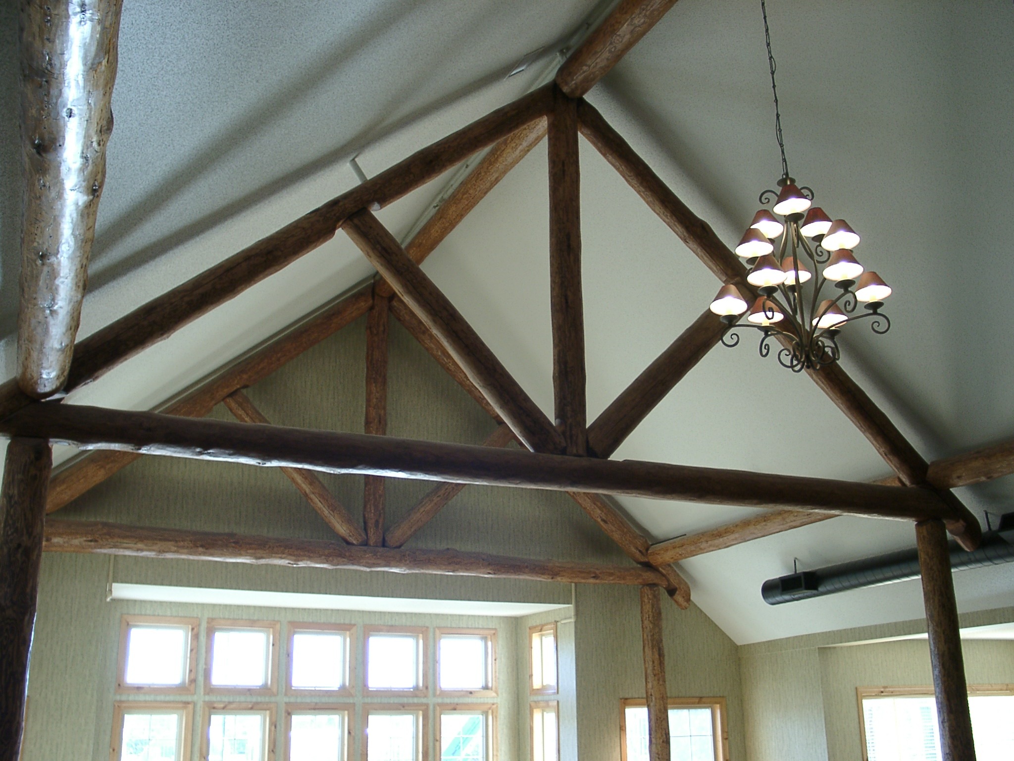 Wood log beams and arch support