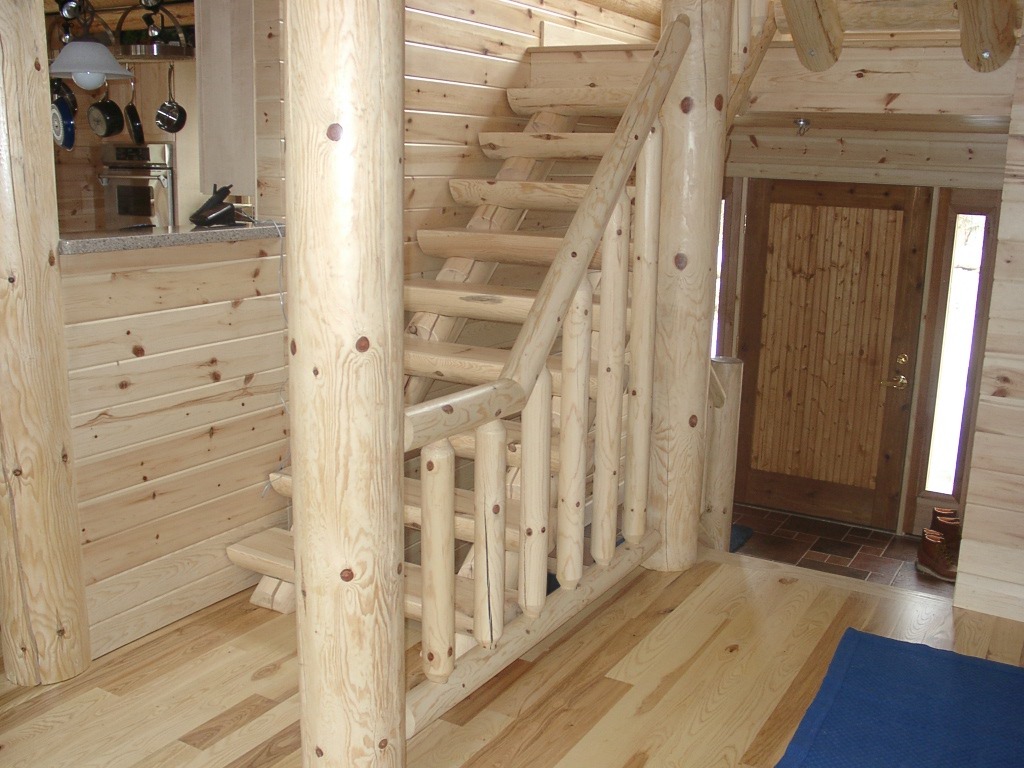 Wooden log cabin with natural stairs | Wood Stair Railings