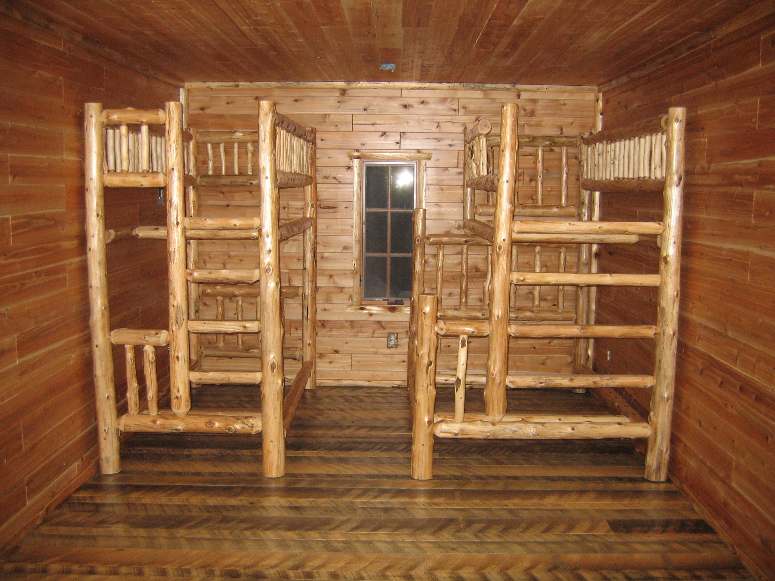 Custom Bunk house bunk bed frames hewn from natural wood logs