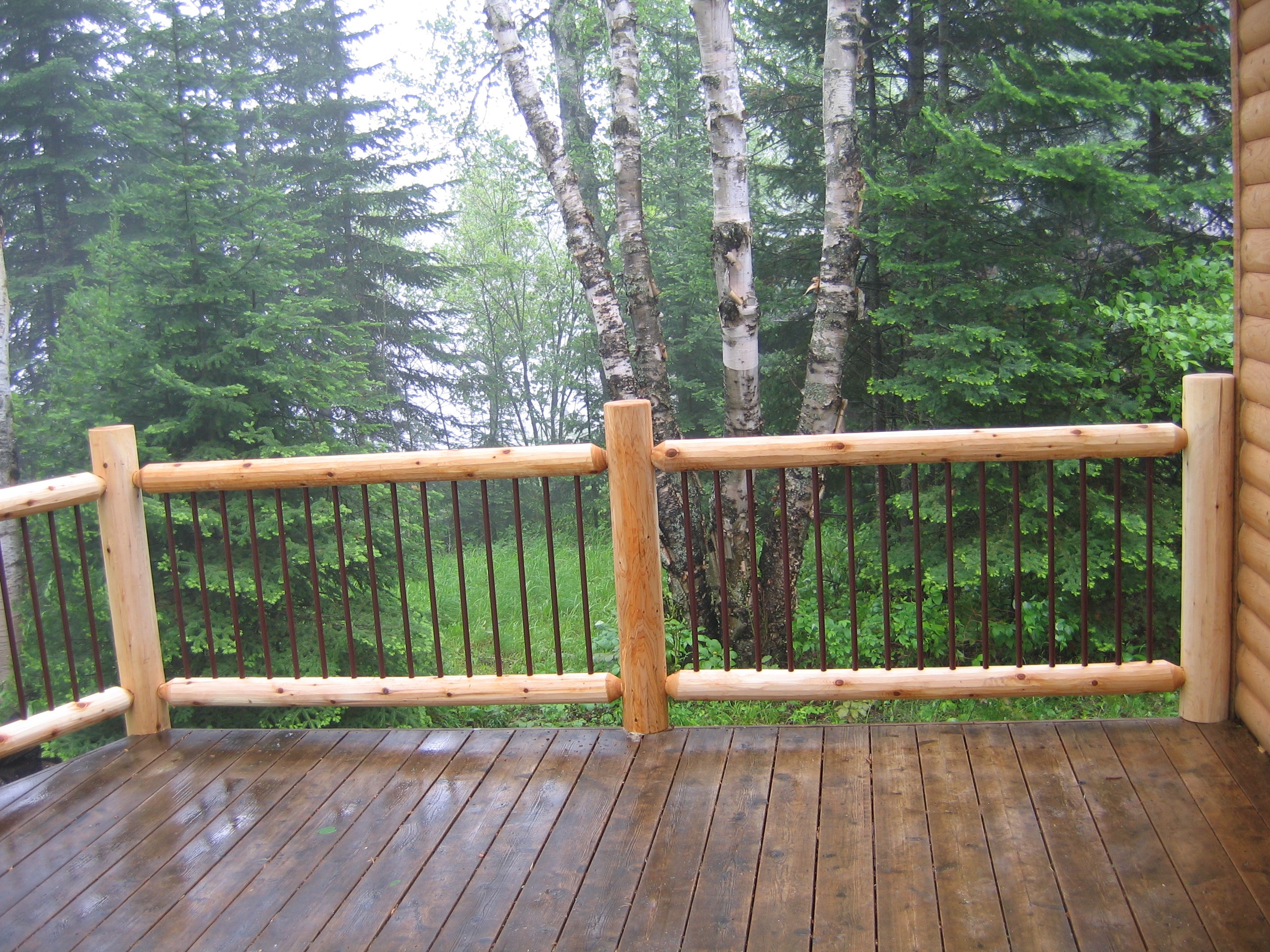 natural timber deck railing with wrought iron bars | Outdoor stair railings