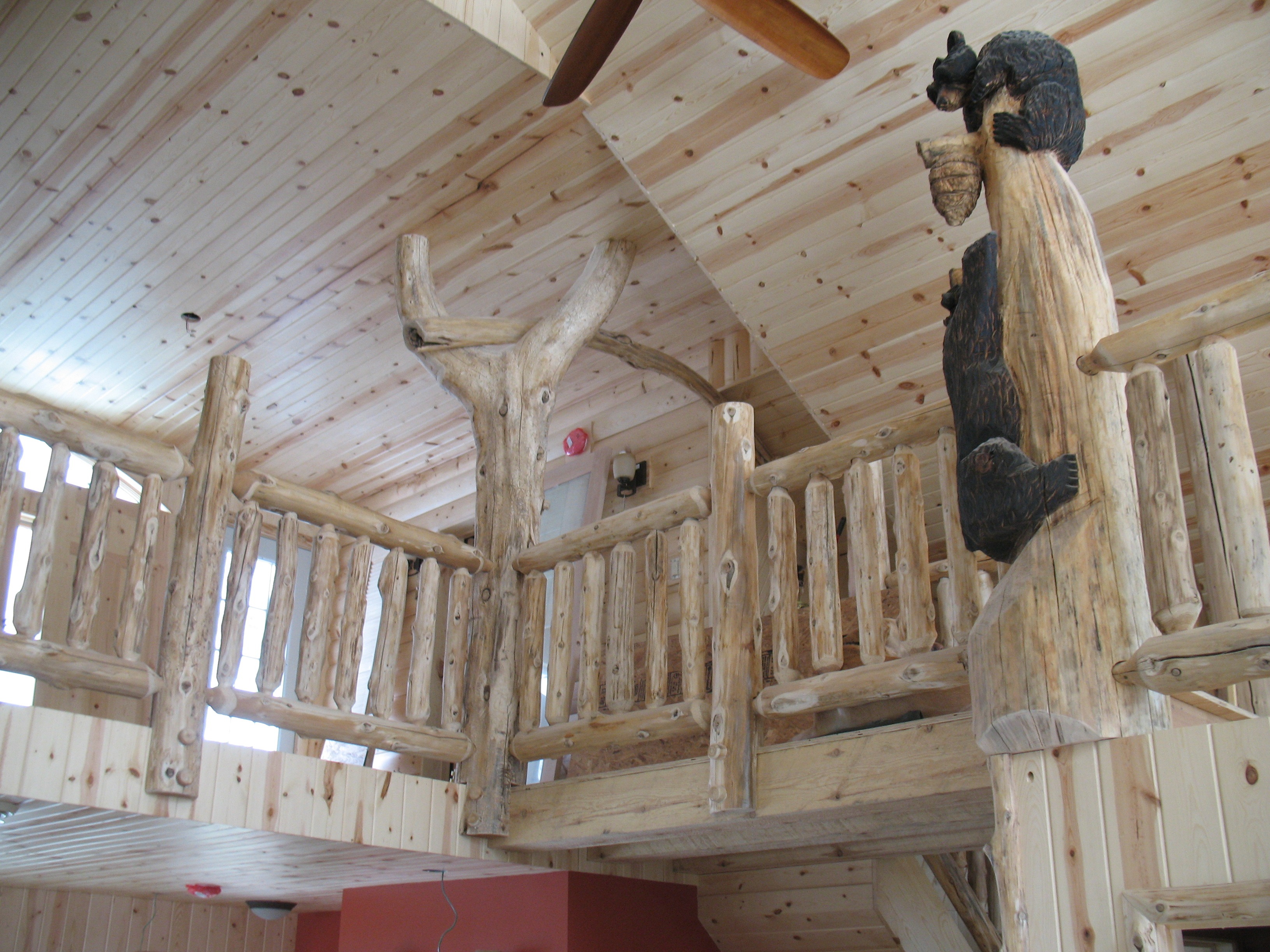 custom carved wooden black bear log cabin interior | Wood Stair Railings