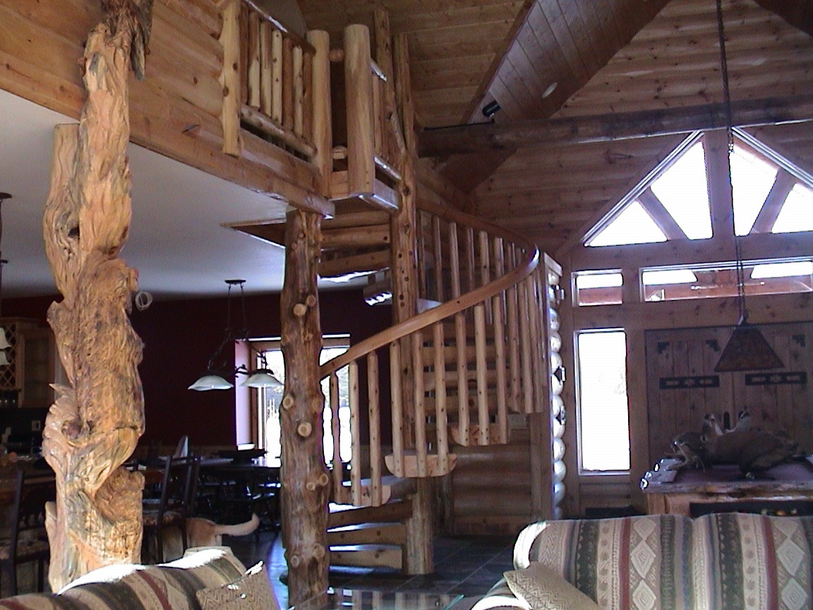 natural timber log cabin accents, support beams, and spiral stairs | Spiral Staircase
