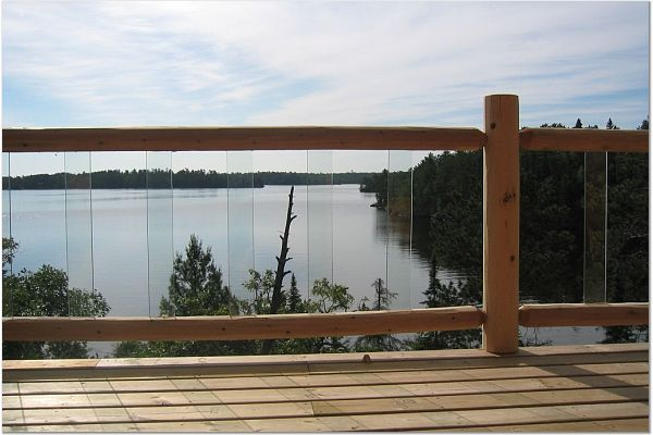 deck log railing over looking a lake | outdoor stair railings